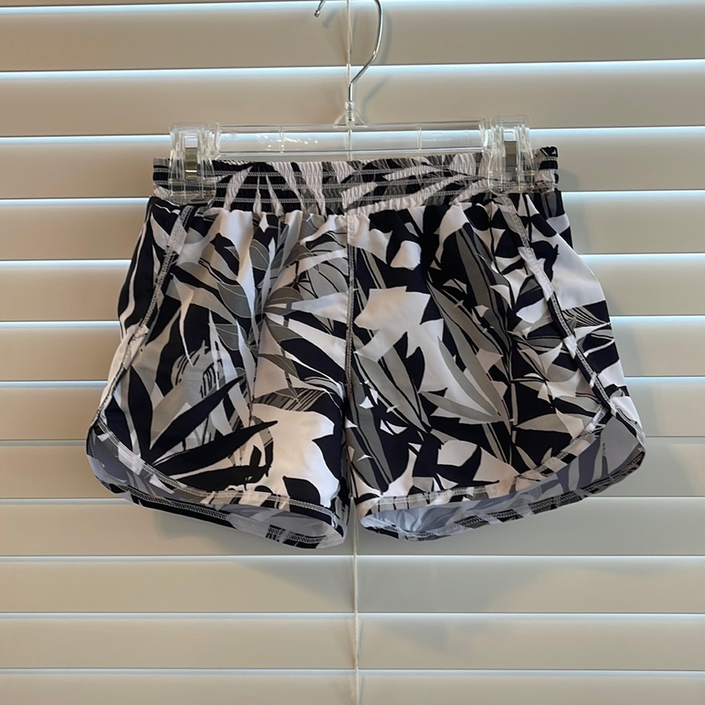The brand is Old Navy Active. They are a size 8. Black and white flower shorts.